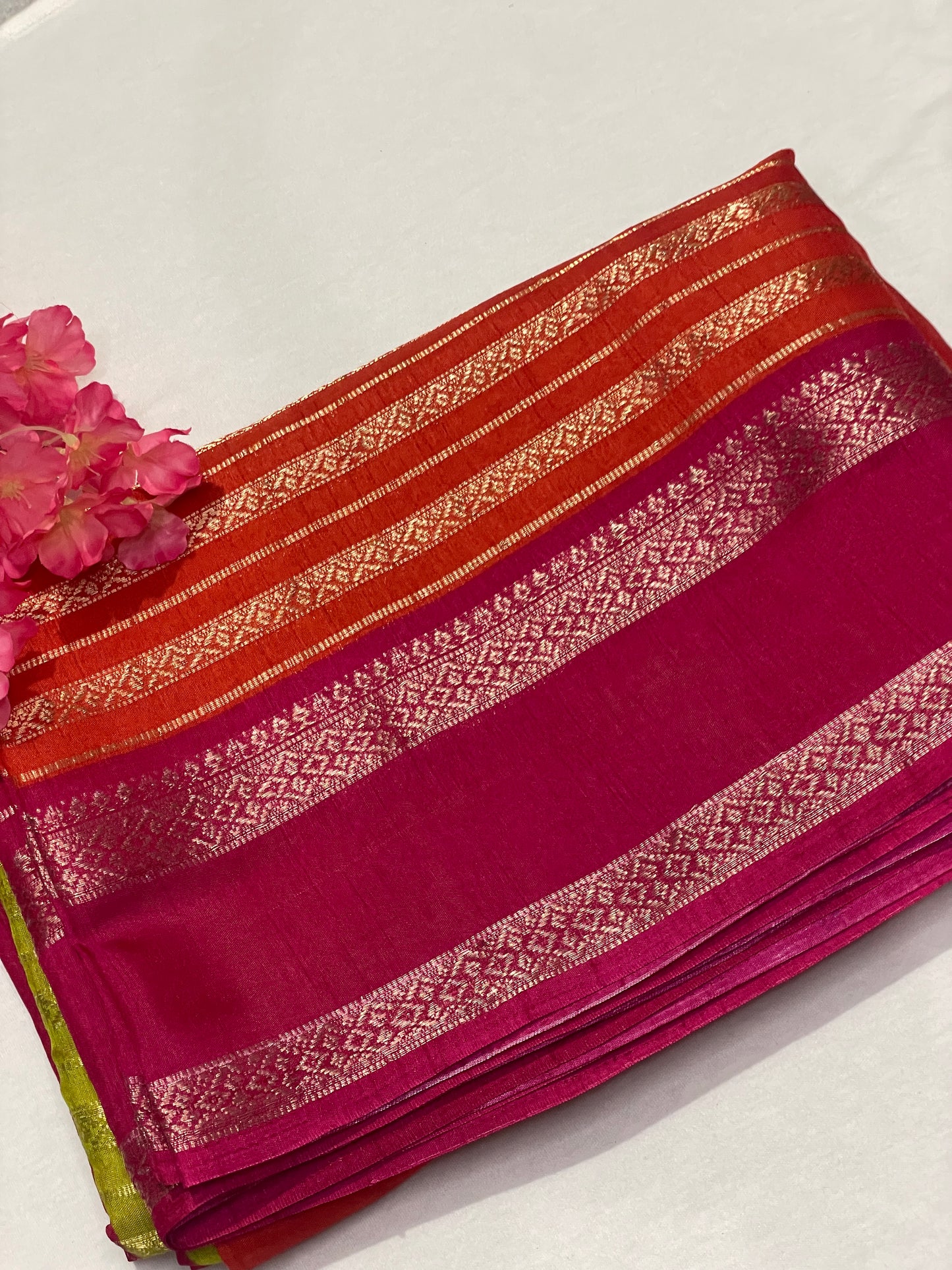 Pink and orange striped Semi Crape Saree