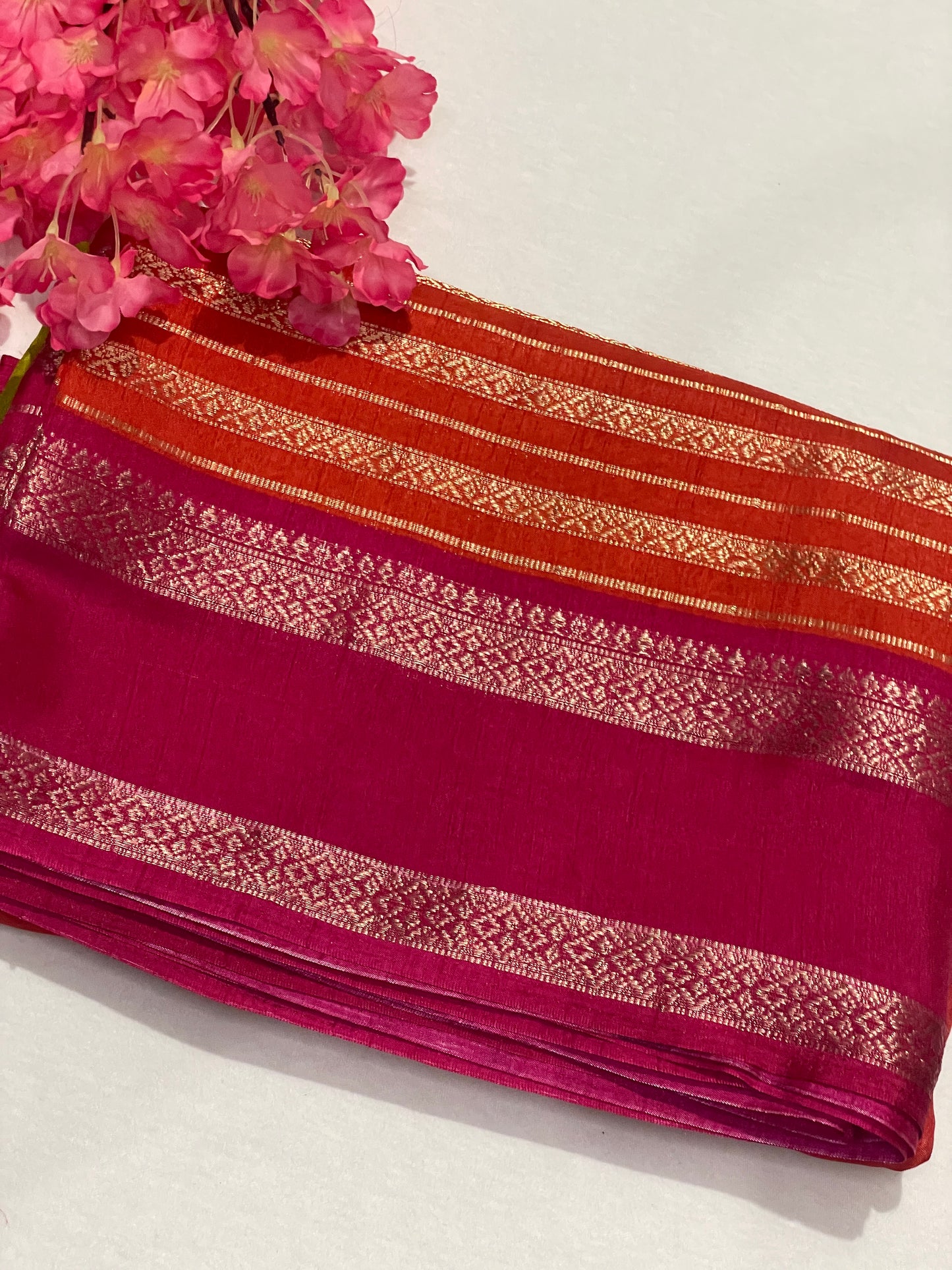 Pink and orange striped Semi Crape Saree
