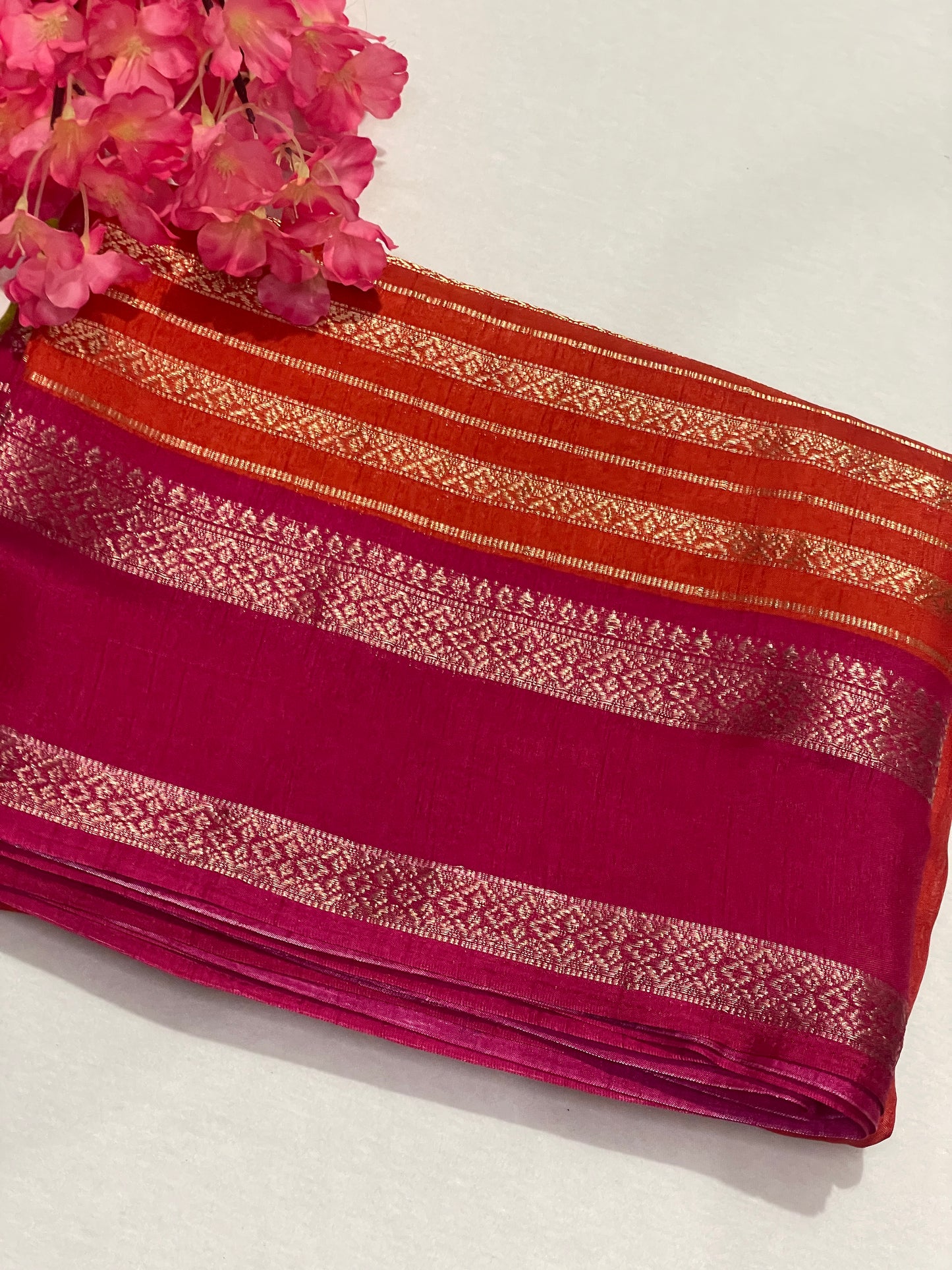 Pink and orange striped Semi Crape Saree