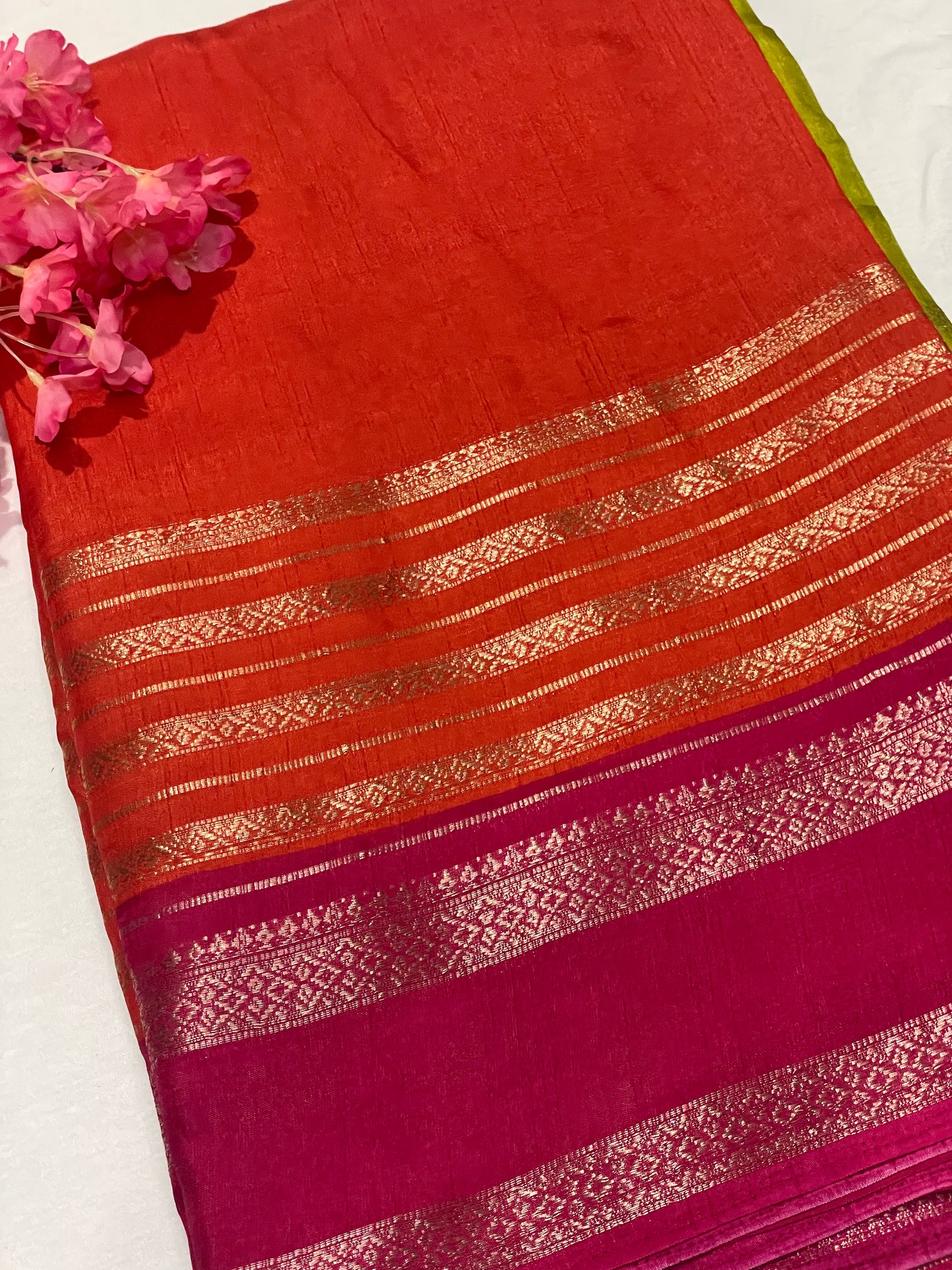 Pink and orange striped Semi Crape Saree